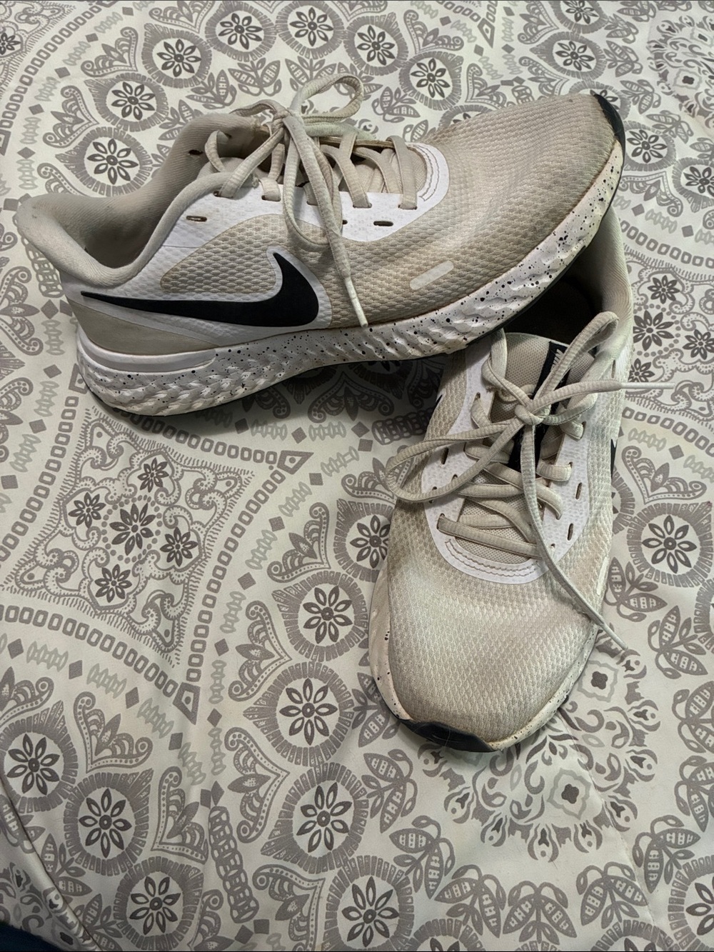 Nike women’s Athletic Shoes -White with Black Swoosh and speckled sole.